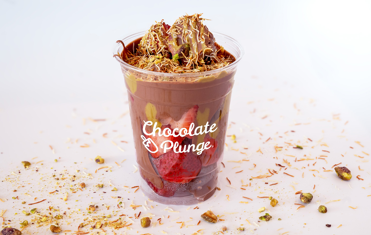 melted chocolate covered strawberries with crunchy, butter-toasted kataifi (shredded filo dough) and creamy pistachio paste or butter 