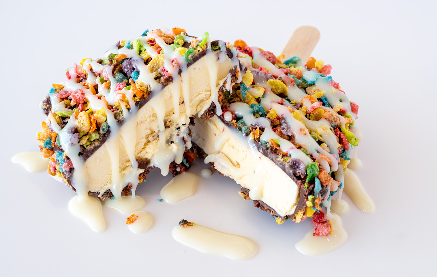 vanilla ice cream bar, dipped in chocolate, then covered with fruity pebbles and a drizzle of sweetened condensed milk